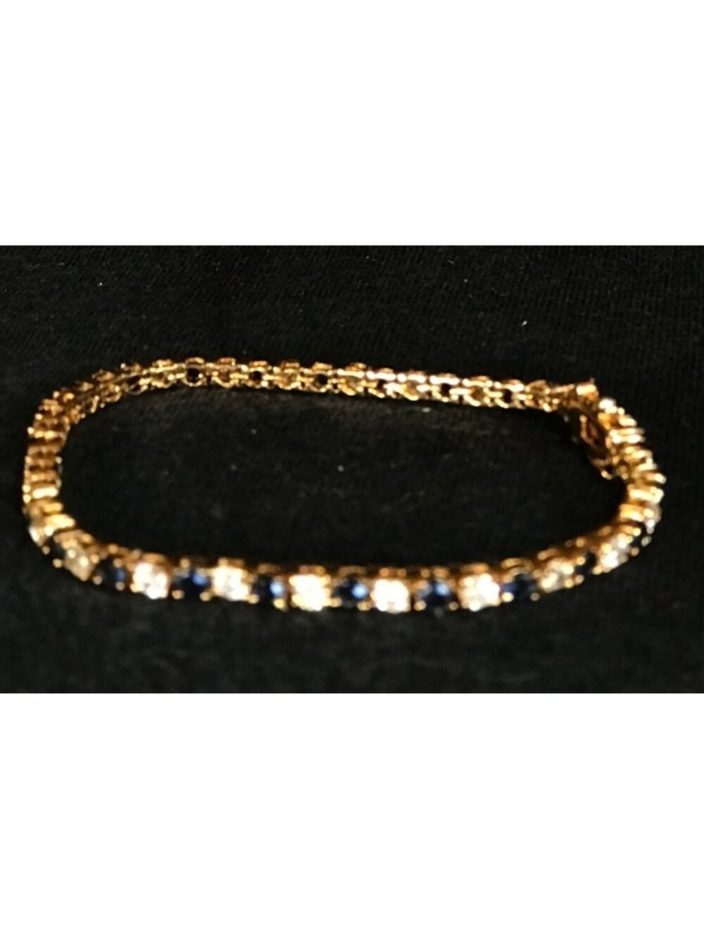 Gold Tone Tennis Bracelet with Blue and Clear Rhinestones with Safety Lock - Picture 4 of 6